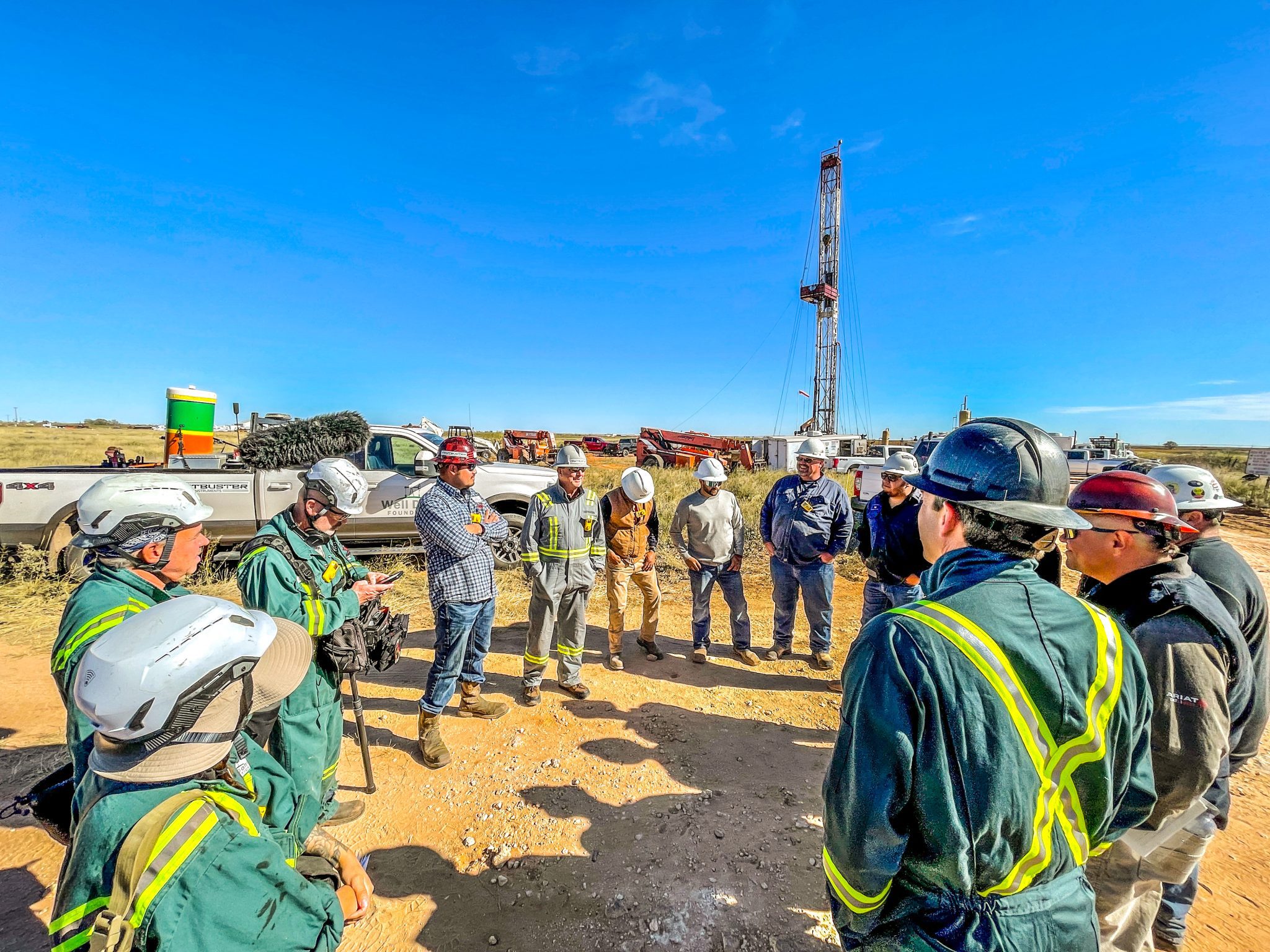 group of people preparing for an orphan well plugging event with the well done foundation.
